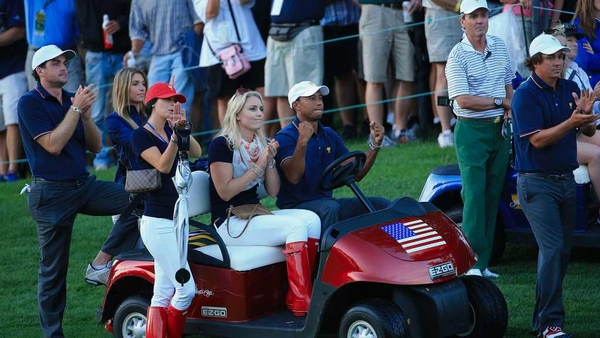 Tiger Woods cheers on his team-mates