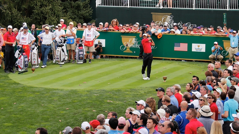 Tiger Woods and Matt Kuchar beat Hideki Matsuyama and Adam Scott two up