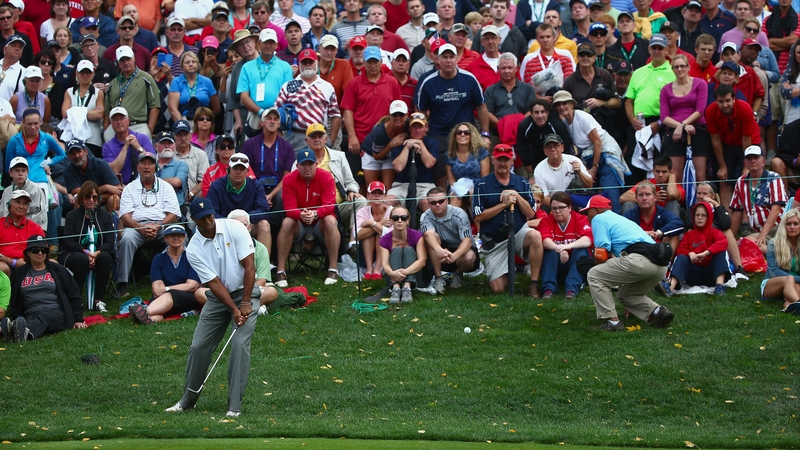 Tiger Woods hits a pitch shot on the 17th on the way to victory
