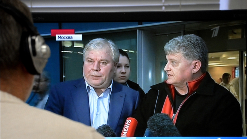 Russian state media broadcasting visit of Lon Snowden (right) in Moscow with his son's lawyer Anatoly Kucherena