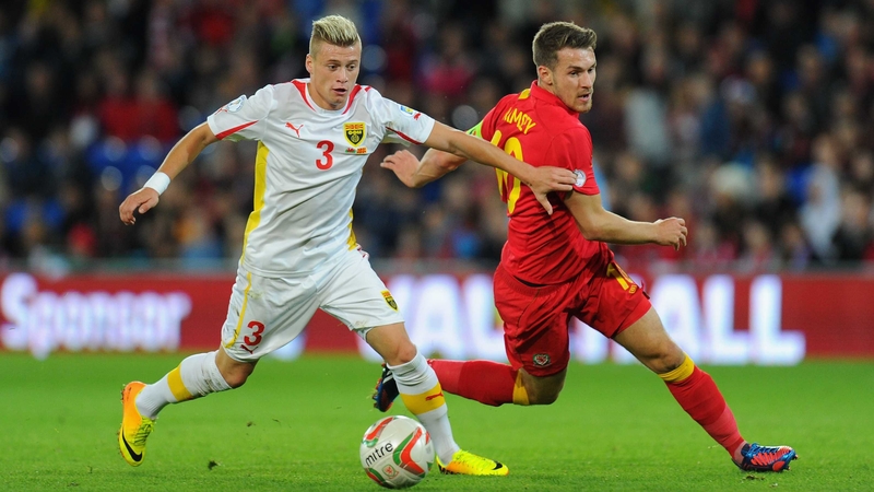 Wales player Aaron Ramsey (r) challenges Ezgjan Alioski of Macedonia