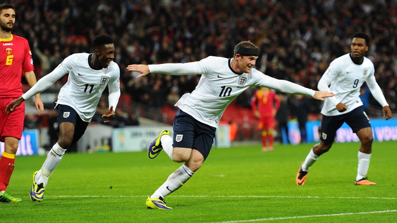 Wayne Rooney celebrates scoring England's first goal with team-mate Danny Welbeck