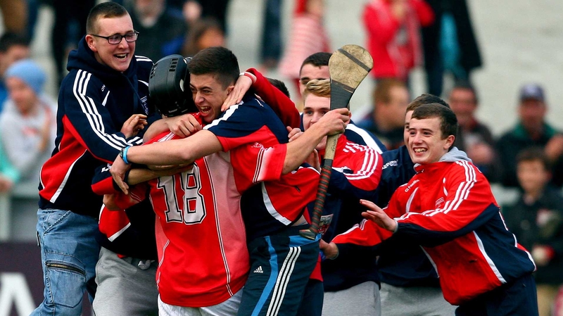 Sean Hogan of Passage is mobbed by supporters at the final whistle