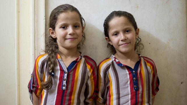 Twins Maya and Mai, aged eight, who live in Irbid