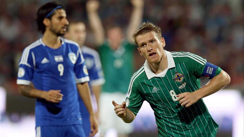 Steven Davis wheels away after scoring Northern Ireland's equaliser in Tel Aviv