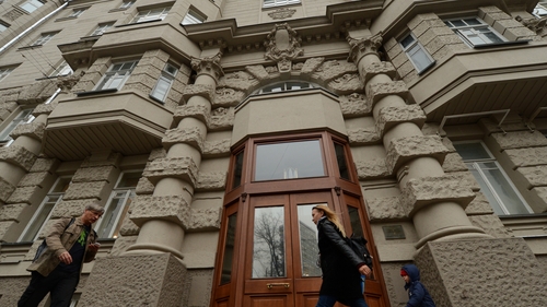 People walk past the building where the Dutch diplomat was attacked