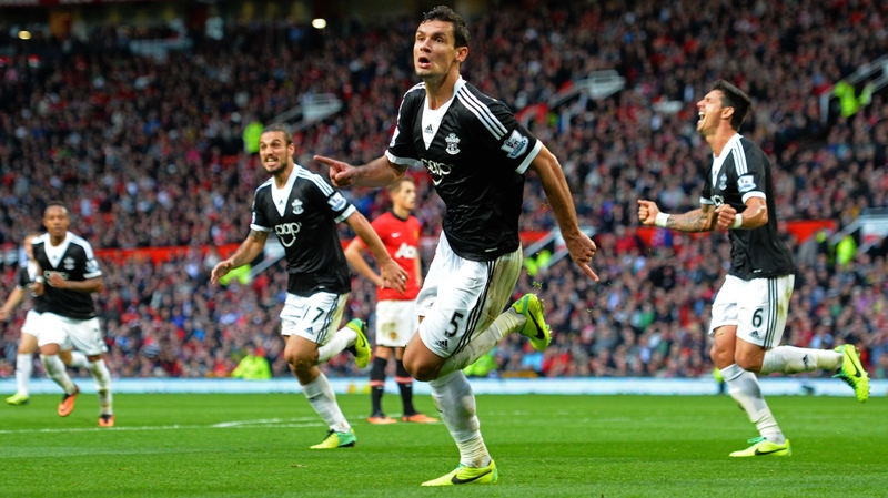 Dejan Lovren and team-mates celebrate their late goal at Old Trafford