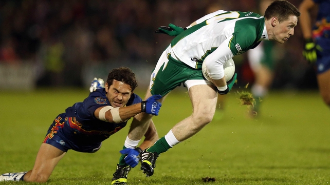 Conor McManus tries to get away from Jarrod Harbrow of Australia