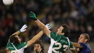 Michael Murphy contests a high ball under the attention of Cameron Ellis-Yolmen