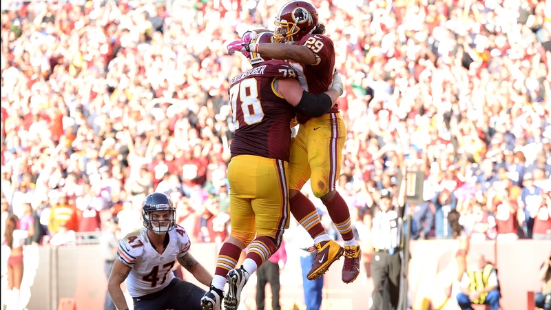 Roy Helu of the Washington Redskins celebrates his game-winning touchdown with teammate Kory Lichtensteiger