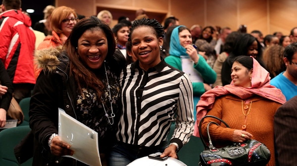 Taibatu Omolara Bello (l) and Banke Lawal from Nigeria after their citizenship ceremony