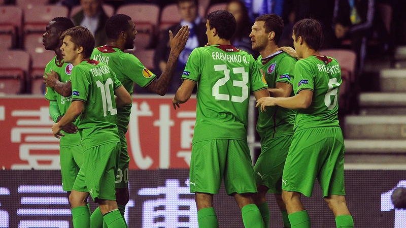 Rubin Kazan players celebrate their opening goal against Wigan