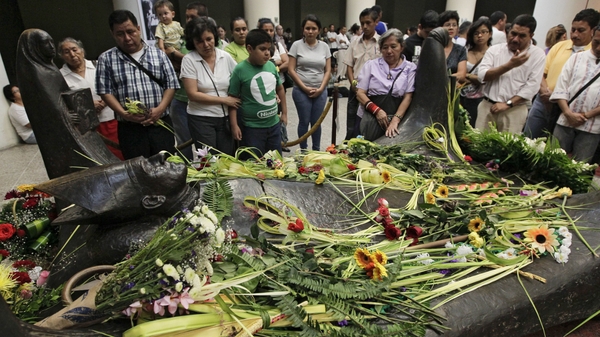 Salvadoreans visit the tomb of Archbiship Oscar Romero on the 33rd anniversary of his murder earlier this year