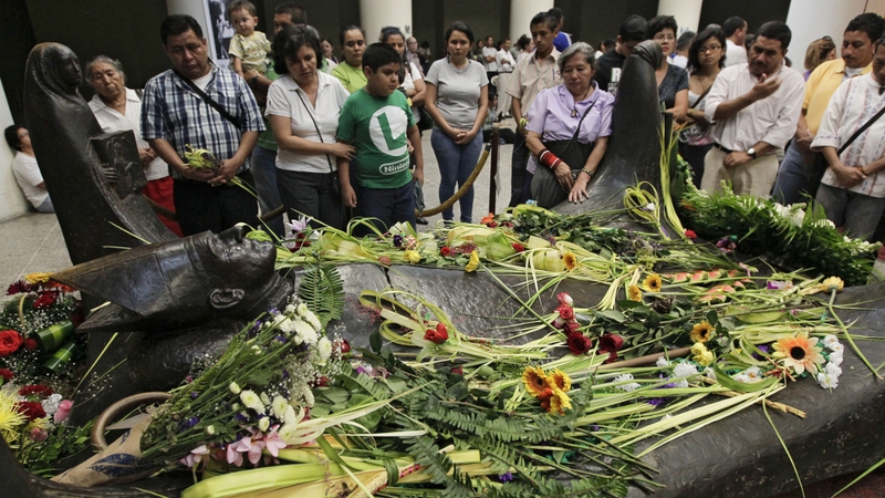 Salvadoreans visit the tomb of Archbiship Oscar Romero on the 33rd anniversary of his murder earlier this year