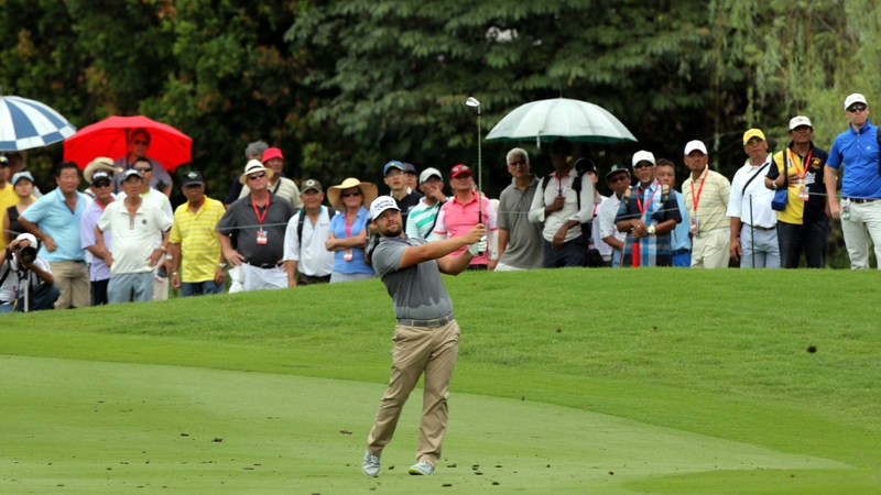 Ryan Moore plays hisi second shot at the ninth