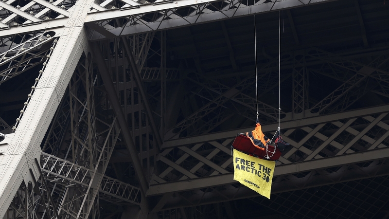 Greenpeace protests from Eiffel Tower over 30 detained in Russia