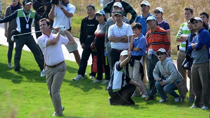 Gonzalo Fernandez-Castano plays from the rough on the ninth hole