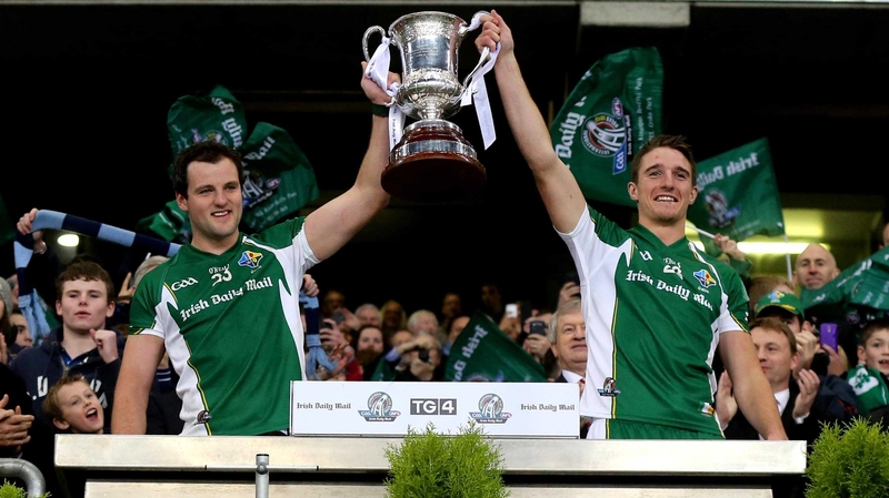 Michael Murphy and Aidan Walsh lift the Cormac McAnallen Cup