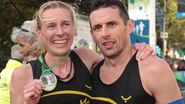 Women's winner Maria McCambridge with her husband Gary Crossan after crossing the finish line