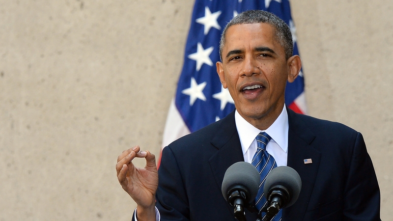 Barack Obama has been forced to defend new healthcare programme after administrative glitches