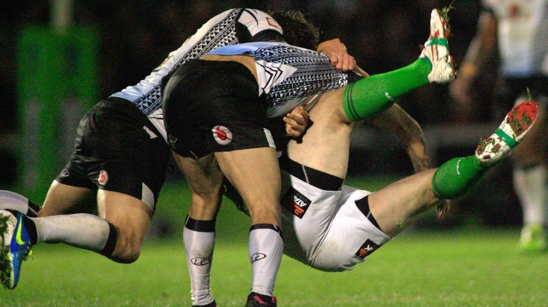 Fiji's Ashton Sims and Aaron Groom tackle Eamon O’Carroll of Ireland