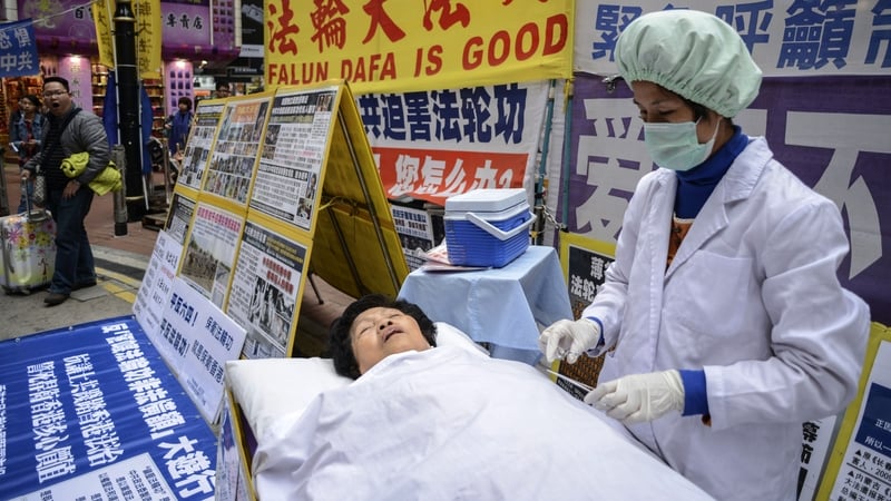A protest with a mock operation earlier this year in Hong Kong against forced organ harvesting in China