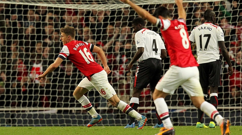 Aaron Ramsey turns to celebrate after scoring Arsenal's second goal