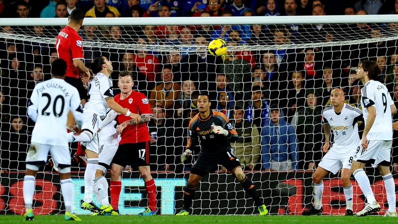 Steven Caulker out-jumps the Swansea defence to score