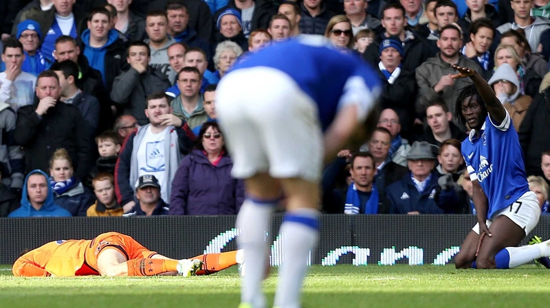 Tottenham goalkeeper Hugo Lloris lies prone on the Goodison Park turf after losing consciousness following a collision with Everton's Romelu Lukaku last season