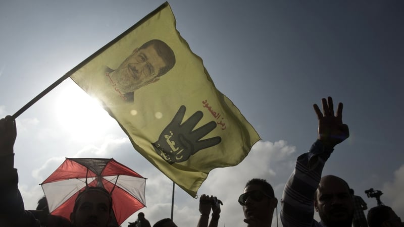 Supporters of Mohammed Mursi gather outside the police academy in Cairo