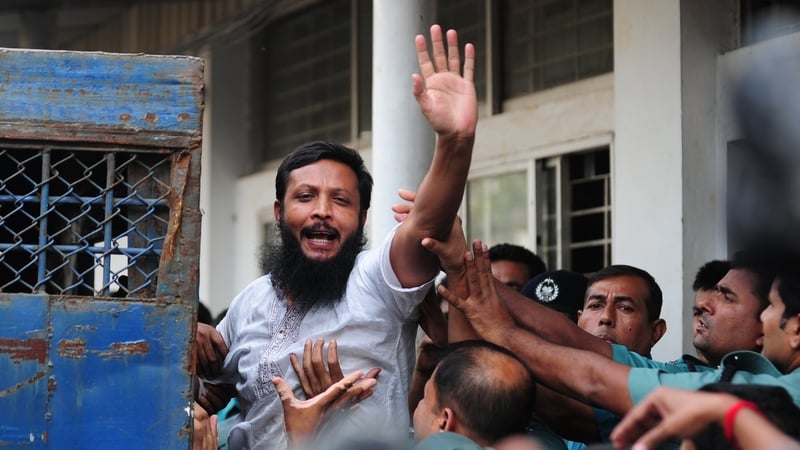 One of the accused soldiers gestures following the announcement of his death penalty at the special court in Dhaka