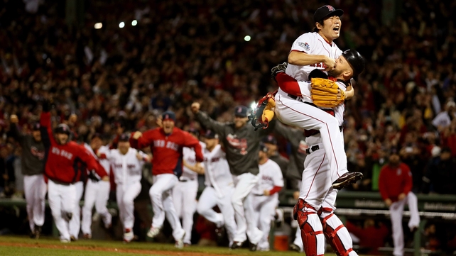 David Ross and Koji Uehara embrace as Boston Red Sox win the World Series at Fenway Park in Boston, Massachusetts