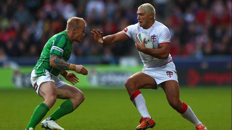 Ireland's Damien Blanch prepares to tackle Ryan Hall (right) of England during their Rugby League World Cup clash