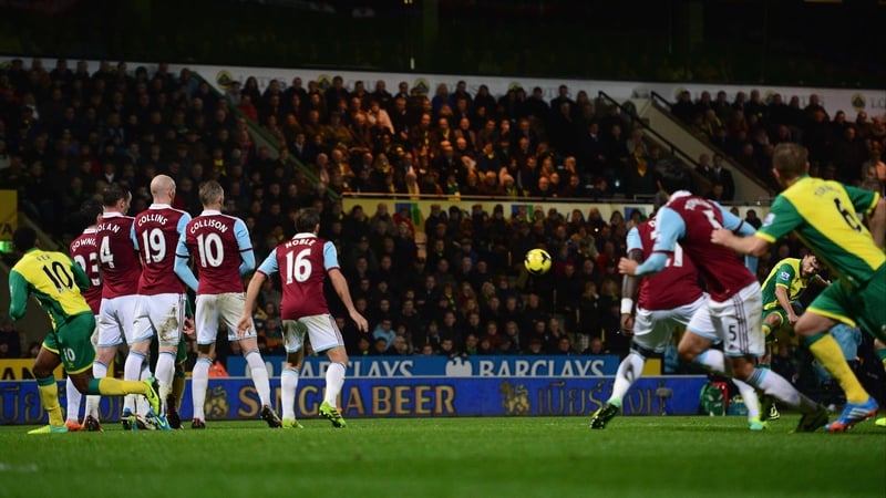 An obscured Robert Snodgrass scores Norwich's second goal from a free-kick