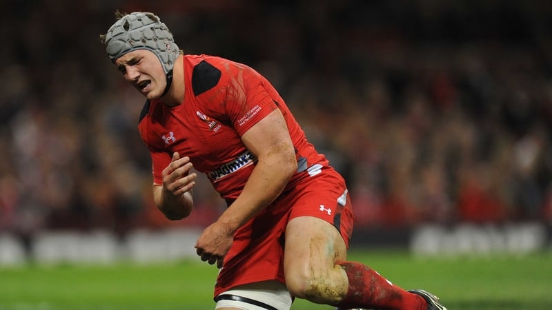 Jonathan Davies reacts after injuring his shoulder