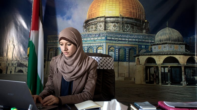Isra Al-Modallal's job is to convey the views of the Hamas government