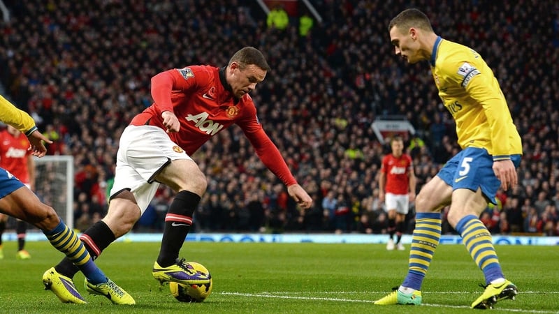 Thomas Vermaelen tracks a Wayne Rooney run