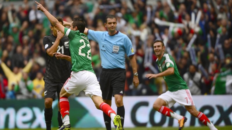 Paul Aguilar (l) and Miguel Layun celebrate after Aguilar opened the scoring