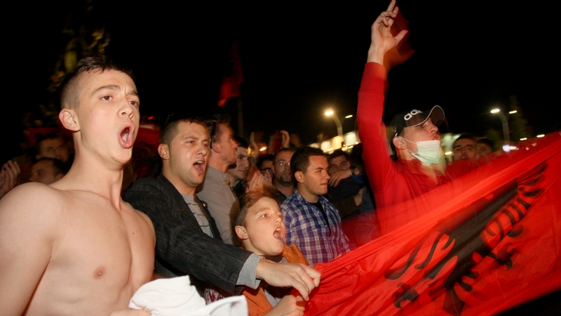 Albanian environmental activists celebrate in Tirana after their country rejected international plans to host destruction of Syrian chemical weapons
