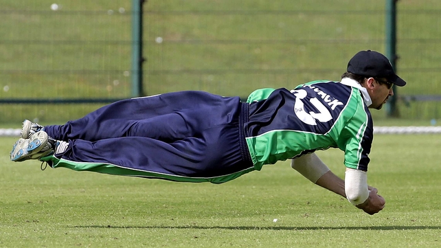 Alex Cusack takes a diving catch against the USA in the World Cup Twenty20 Qualifiers in Abu Dhabi