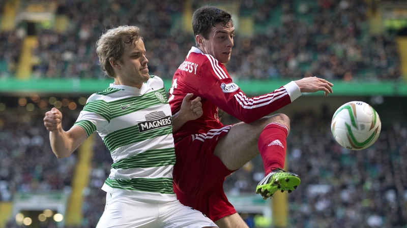 Celtic's Teemu Pukki (l) and Aberdeen's Joe Shauhnessy battle for the ball