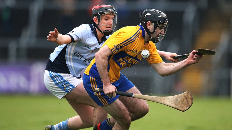 Brian Carey of Sixmilebridge and Na Piarsaigh's David Dempsey in action at Cusack Park