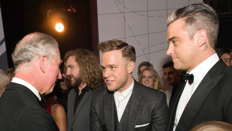 Olly Murs meeting Prince Charles with Robbie Williams at yesterdays Royal Variety Performance in London