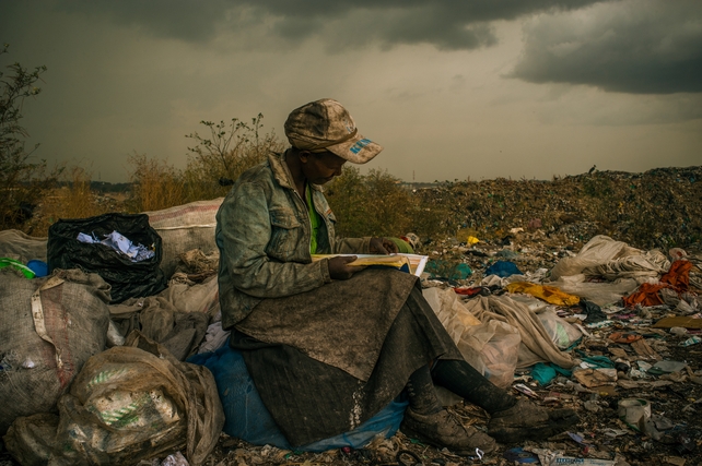 Woman Reading at Dandora Municipal Dump, Nairobi, Kenya
 (Micah Albert, USA, Redux Images for Pulitzer Center on Crisis Reporting)