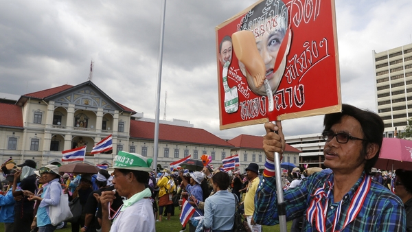 Anti-government protesters demonstrate outside army headquarters
