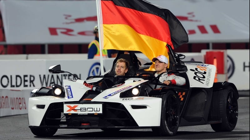 Michael Schumacher and Sebastian Vettel race together at the annual race of Champions event as Team Germany