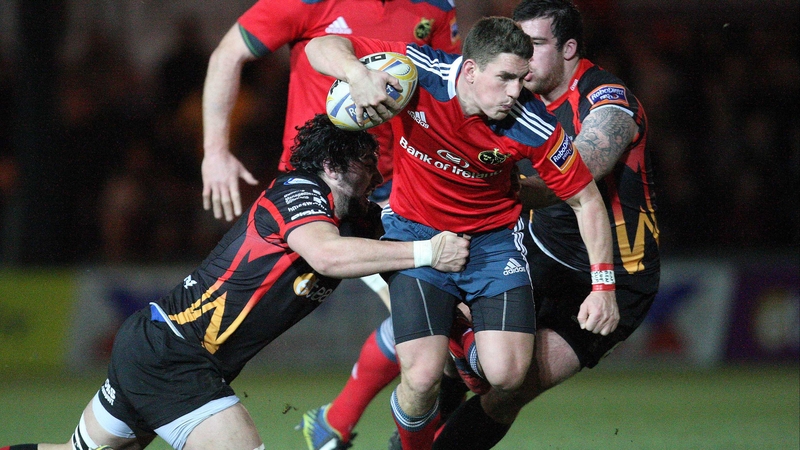 Munster's Ian Keatley struggles to escape from Cory Hill and Owen Evans