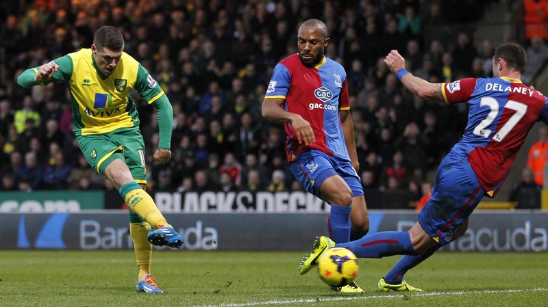 Norwich striker Gary Hooper shoots to score the decisive goal