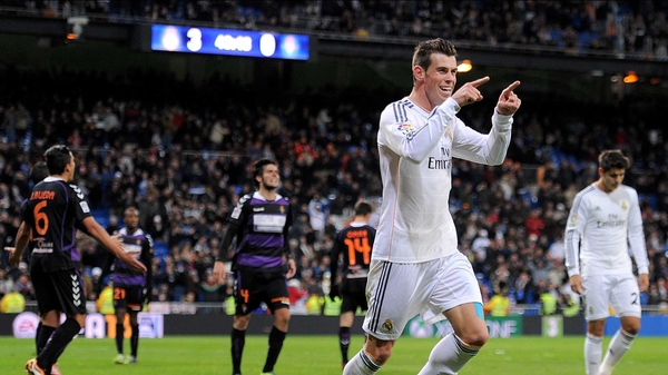 Gareth Bale celebrates after scoring Real's fourth and completing his hat-trick