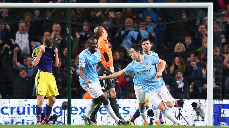 Samir Nasri (r) celebrates City's second goal with Yaya Toure